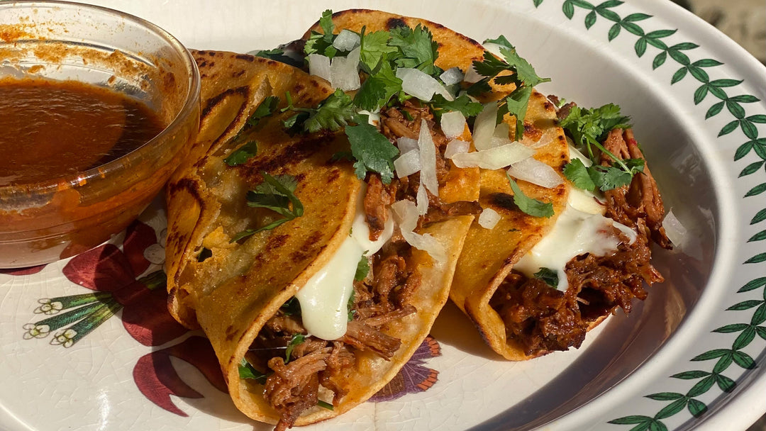 Beef Birria Queso Tacos with dipping sauce